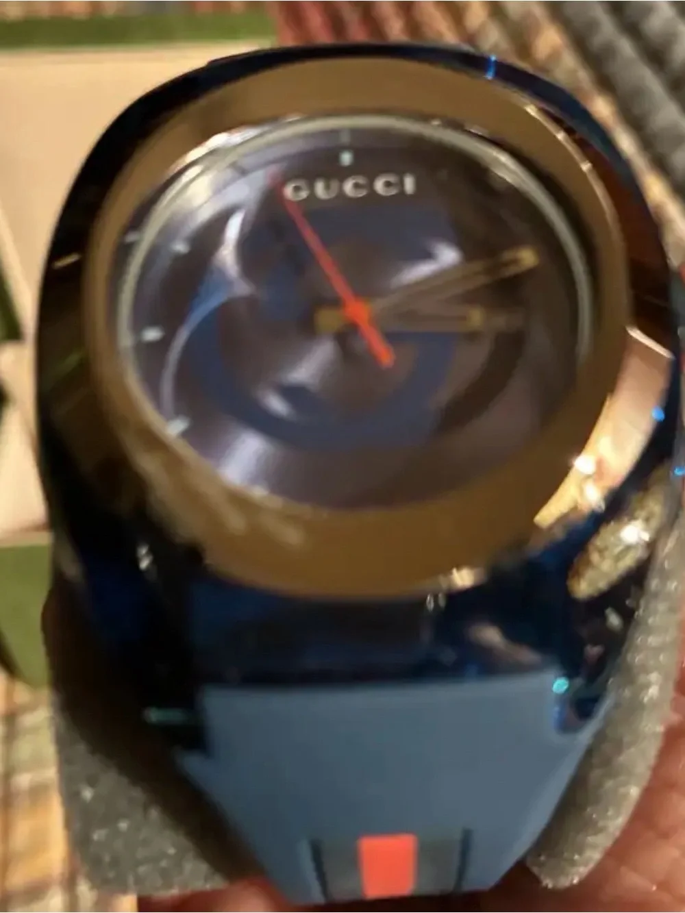 Gucci Men’s Blue Dial Watch with Gold Bezel and Red Accent